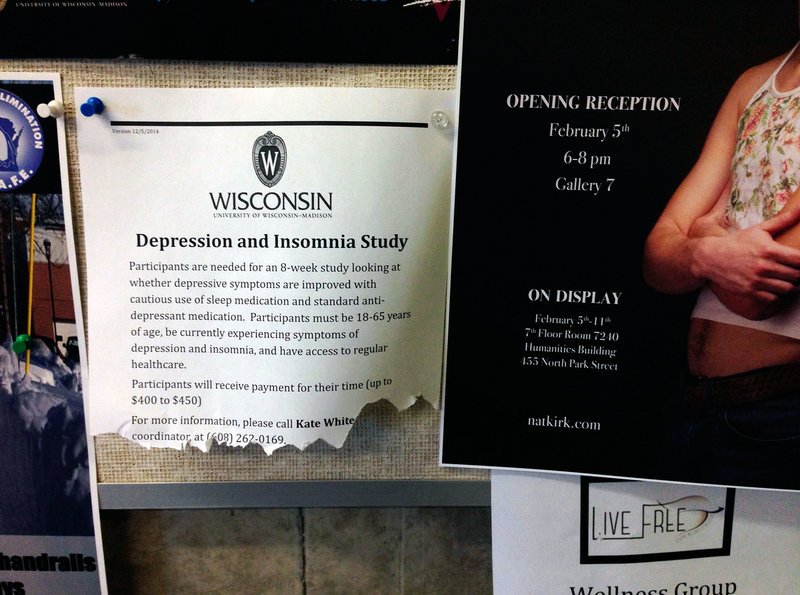A posting on a bulletin board outside the counseling offices at the University of Wisconsin invites people to participate in a study on depression and insomnia.